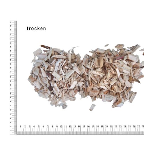 Ein Haufen Holzspäne mit Lineal, Text 